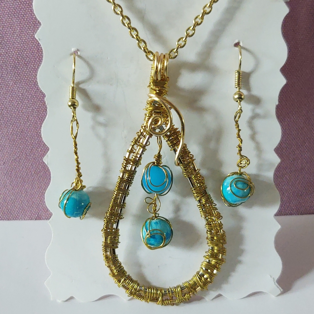 Glass turquoise beads in gold setting